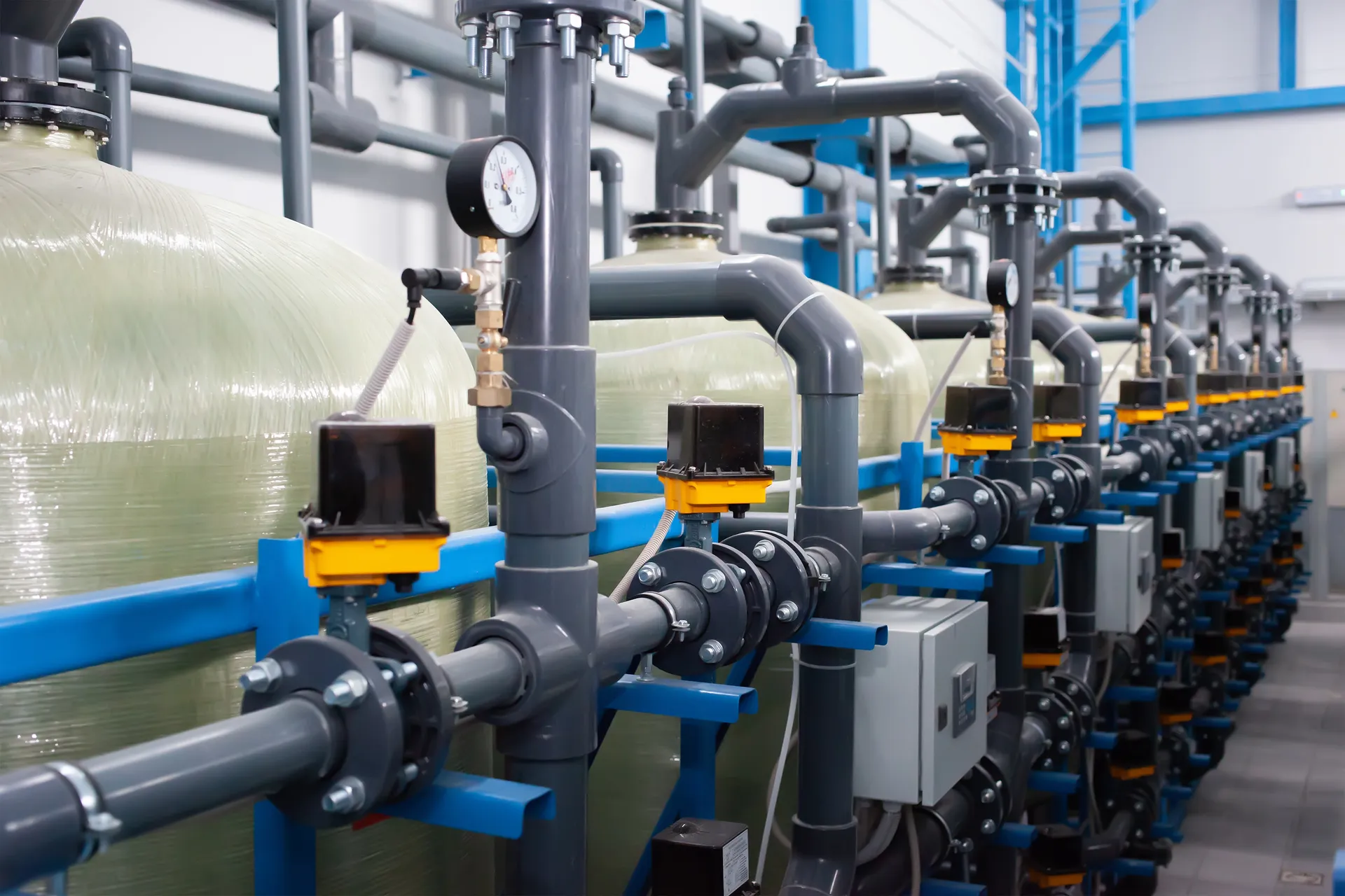 Rows of filter vessels with pressure gauges in a water treatment plant