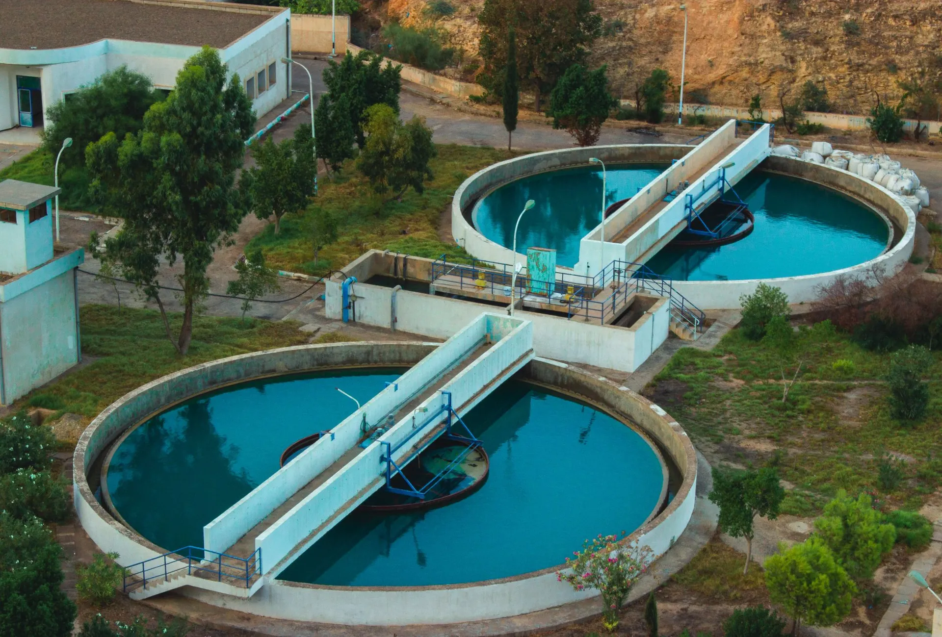 Aerial view of circular clarifiers with clear water at a treatment plant