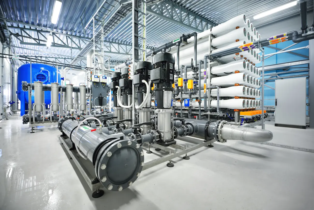 Modern reverse osmosis plant hall with pumps and membrane racks