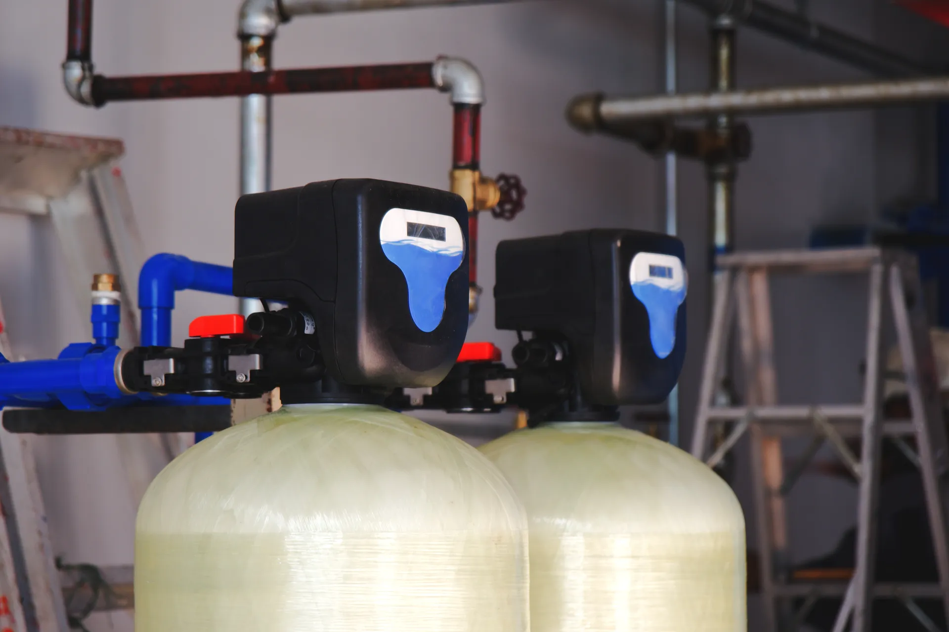 Filtration vessels with automatic control valves in an industrial plant room
