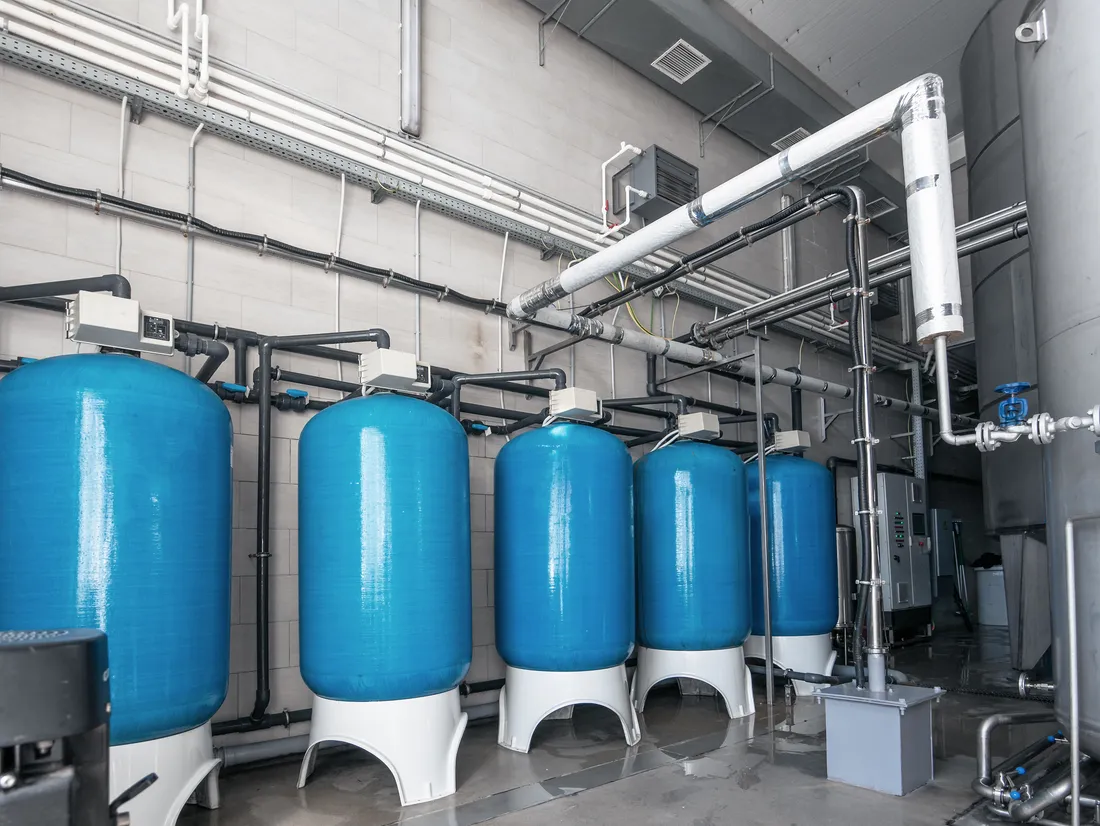 Water softener vessels treating feedwater ahead of a CIP system